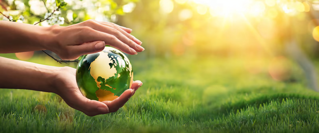 Hands holding earth - green sustainability